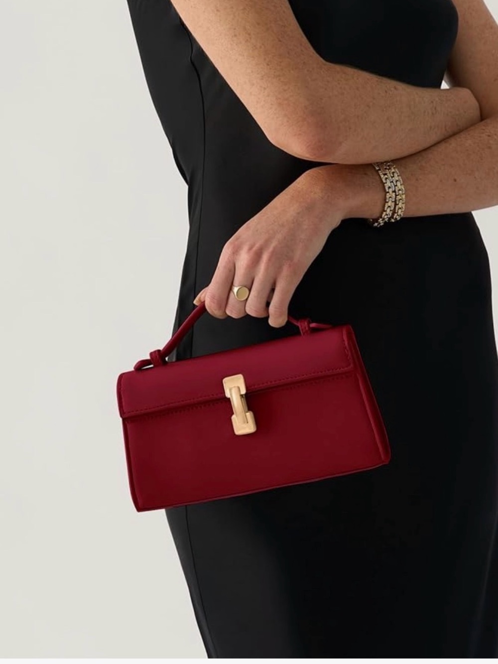 Dark red small clutch with shoulder strap